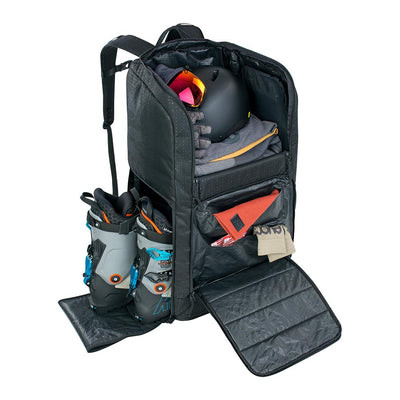 EVOC Gear Bag with compartments open showing skiing gear and boots stowed safely apart