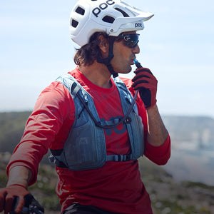 EVOC Hydro Pro hydration vest worn by mountain biker overlooking the sea mobile view