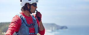 EVOC Hydro Pro hydration vest worn by mountain biker overlooking the sea