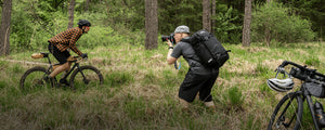 EVOC camera pack worn by professional photographer