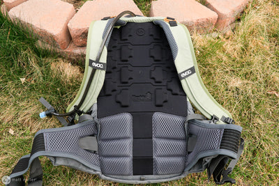 EVOC Trail Pro 16L backpack view showing back protector, venting features on the back, and secure wrap around elastic hip strap