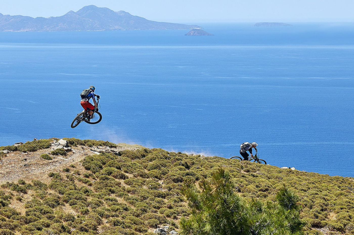 Mountain bikers wearing EVOC backpacks in Greece